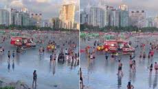 Guarda-vidas do Grupamento de Bombeiros Marítimo durante o resgate das adolescentes na Praia do José Menino, em Santos; jovem de 12 anos foi encaminhada ao hospital após apresentar sinais de afogamento - Imagem: Reprodução