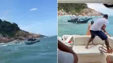 Barco pesqueiro é resgatado por outras embarcações após ficar à deriva próximo a pedras durante mudança repentina no tempo em Guarujá - Imagem: Pedro Dias