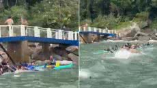 Equipes de resgate atuam após canoas havaianas serem levadas pela correnteza na região da Ilha das Palmas, em Guarujá - Imagem: Adriano Neris