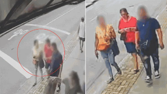 Câmera de segurança registra momento em que idosa segue com suspeitos antes de ter pertences levados em golpe em São Vicente - Imagem: Reprodução/Câmera de Segurança