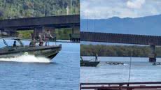 Policial militar salta em embarcação desgovernada para resgatar dois homens no Mar Pequeno - Imagem: Reprodução