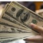 O dólar abre a sessão em leve queda, enquanto investidores aguardam dados de inflação e política monetária - Imagem: Divulgação