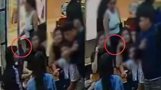 Uma mulher furtou a bolsa de uma família enquanto um comparsa distraía os clientes no Brisamar Shopping, em São Vicente. - Foto: Imagem / Reprodução