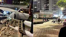 Carro rompeu a proteção da Avenida Miguel Alonso Gonzalez e caiu dentro de um canal em Guarujá; acidente foi registrado por câmeras de monitoramento. - Imagem:  Arquivo Pessoal / Luigi Giopato
