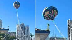 Balão caiu sobre escola municipal e depois terminou em frente a uma igreja no bairro Gonzaga, em Santos, neste sábado (18) - Imagem: g1 Santos