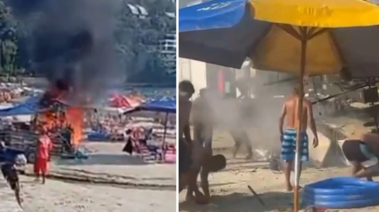 Banhistas utilizam areia para conter incêndio que destruiu carrinho de frutos do mar na praia da Enseada, em Guarujá. - Imagem: Reprodução