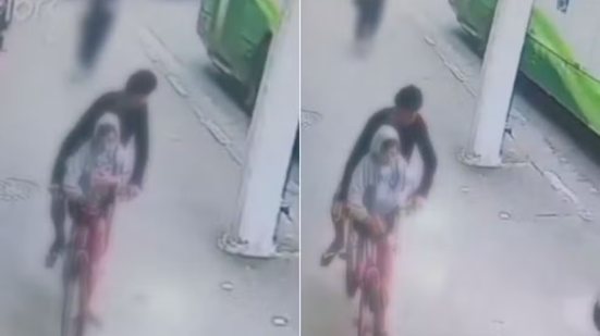 Câmeras do Centro de Controle Operacional de Santos registraram uma mulher perseguindo suspeitos após a subtração de seu celular em um ponto de ônibus no Centro da cidade - Imagem: Reprodução