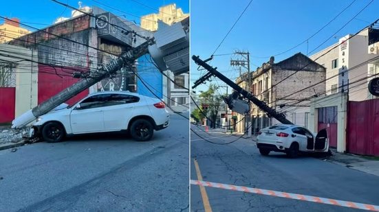 BMW ficou sob um poste após colisão registrada na Avenida São Francisco, no Centro de Santos, provocando interdição da via e interrupção no fornecimento de energia elétrica - Imagem: g1 Santos
