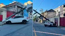 BMW ficou sob um poste após colisão registrada na Avenida São Francisco, no Centro de Santos, provocando interdição da via e interrupção no fornecimento de energia elétrica - Imagem: g1 Santos