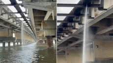 Vazamento em tubulação sob a Ponte do Mar Pequeno, em São Vicente, foi registrado por um morador que afirma acompanhar o problema há meses. A Sabesp programou o início dos reparos para terça-feira (22) - Imagem: Paulo Luiz Bárbara Lourenço