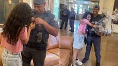 Menina de 10 anos entrega carta e presente ao cabo Willian Alves Dias durante reencontro realizado na sexta-feira (16), na sede do comando da Polícia Militar, em São Paulo - Imagem: Arquivo Pessoal